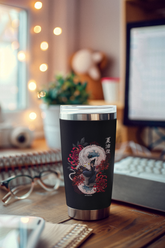 a coffee cup sitting on top of a wooden desk