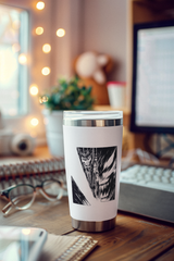 a cup sitting on top of a wooden desk