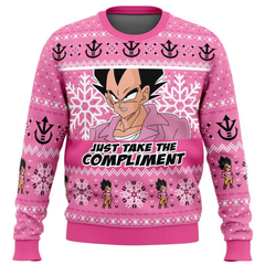 Pink sweater with character design and text 'Just Take the Compliment' on a white background