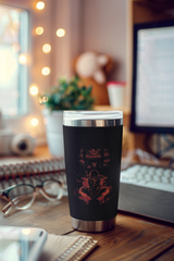 a cup sitting on top of a wooden desk